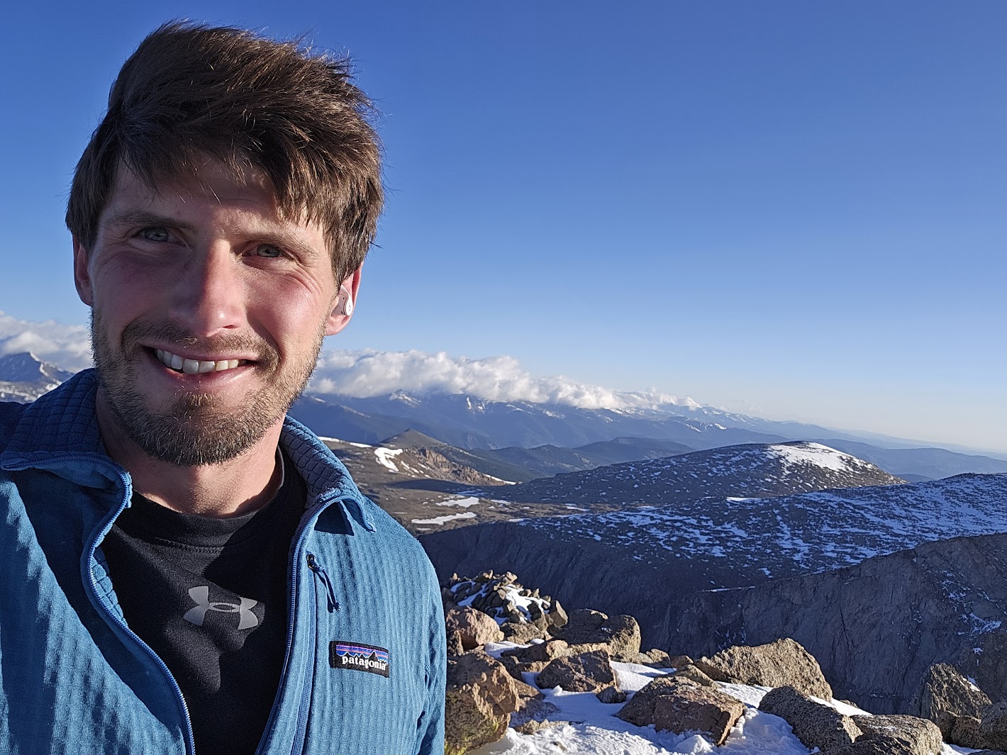 Ryan, founder of PropertyWorks, on a Colorado summit
